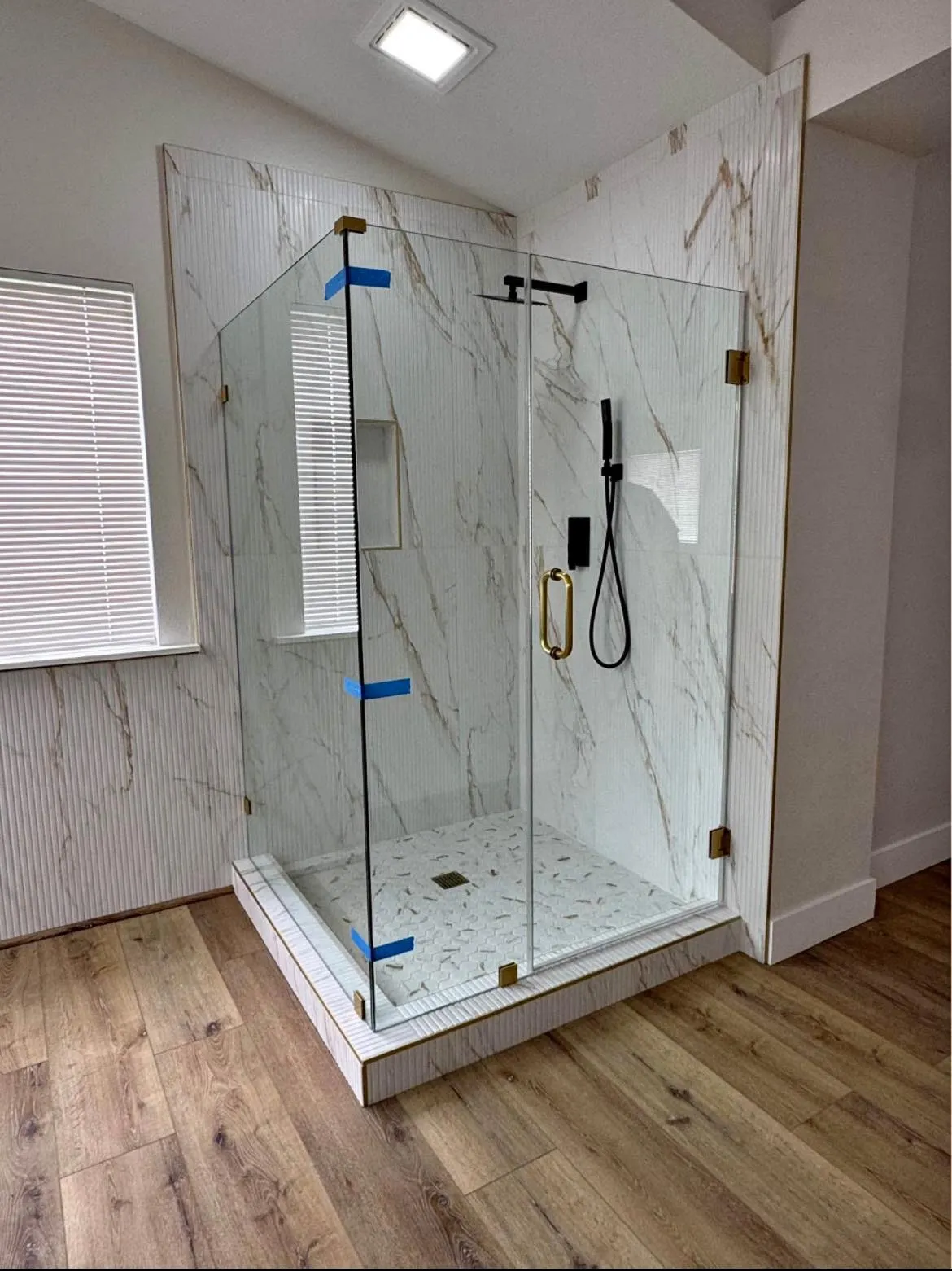 Frameless shower door installation by Glass Smith
